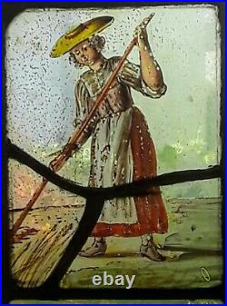 A PAIR OF CHARMING 17th C. FLEMISH STAINED GLASS WINDOW PANELS COUPLE HARVESTING