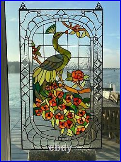 Beautiful peacock on a branch, hand-made stained glass window panel