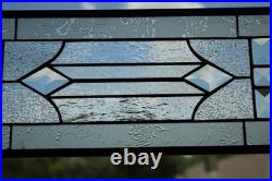 Clear, beveled stained glass window hanging sidelight, transom, obscure texture