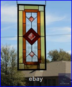 Contemporary stained glass panel with amber and red tones. Decorative window