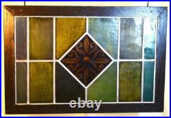 Reclaimed & restored antique stained glass window. Yellow flower centerpiece Reclaimed & restored antique stained glass window. Yellow flower centerpiece