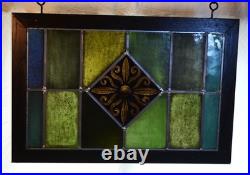 Reclaimed & restored antique stained glass window. Yellow flower centerpiece Reclaimed & restored antique stained glass window. Yellow flower centerpiece