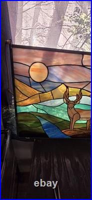 Stained glass panel featuring a buck in a landscape setting, Tiffany Style