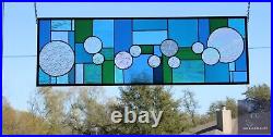 Stained glass transom/sidelight featuring modern geometric art glass