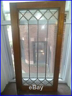 Vintage geometric design leaded glass window 16 X 32 1/2. Solid Oak hardwood